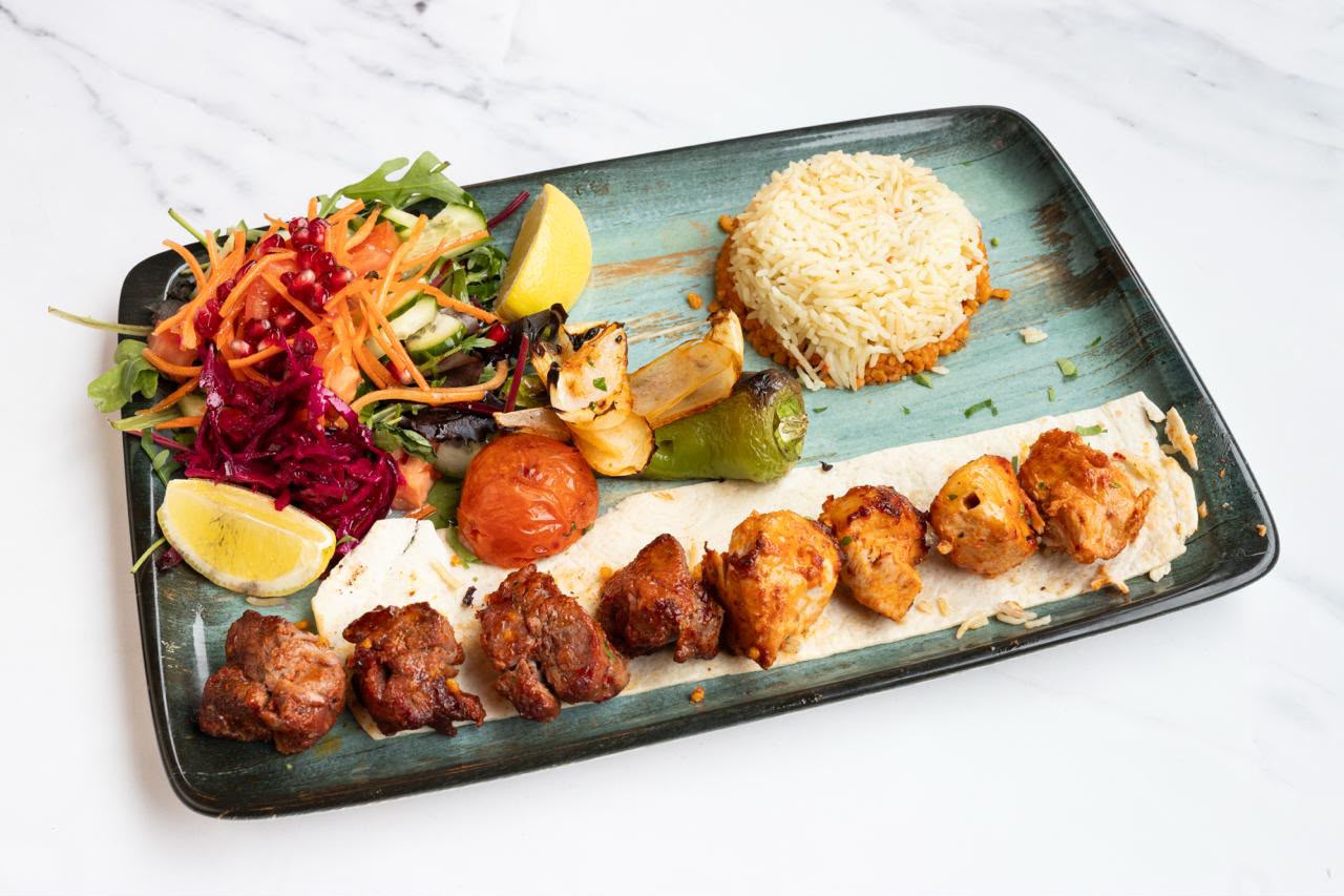 Mixed lamb and chicken shish kebab platter with rice, grilled pepper and salad at The Kervan.